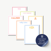 a collection of personalized stationery items, including name cards and monogrammed designs.