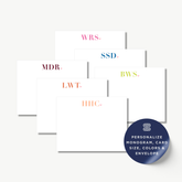 a collection of personalized stationery cards with monogrammed initials, arranged in a grid-like pattern.