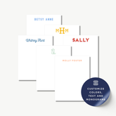 a collection of personalized stationery items, including name cards and blank notepads, each with a unique name or monogram printed on them.