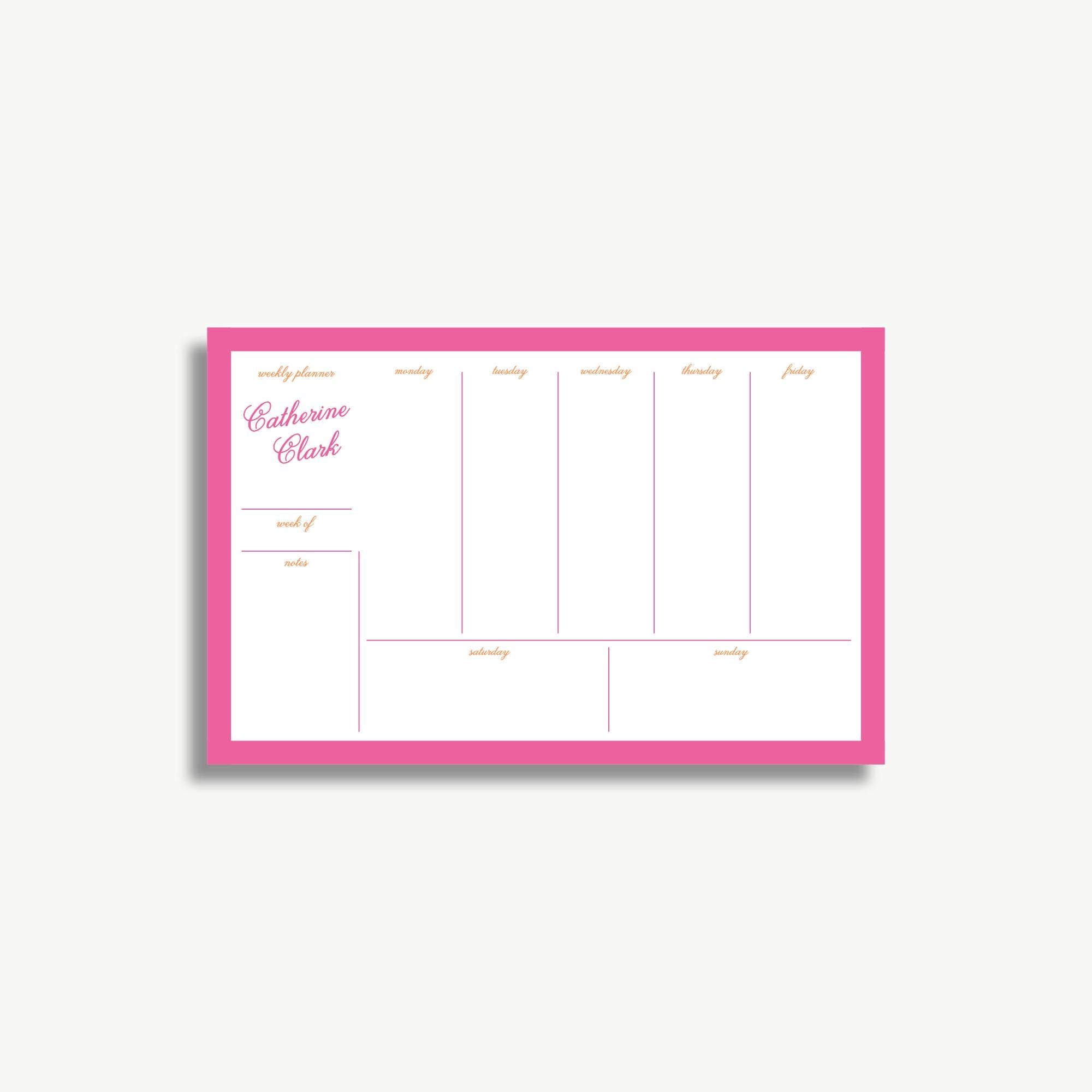 The image is a pink-framed weekly planner with a grid layout, displaying the days of the week and a section for notes.