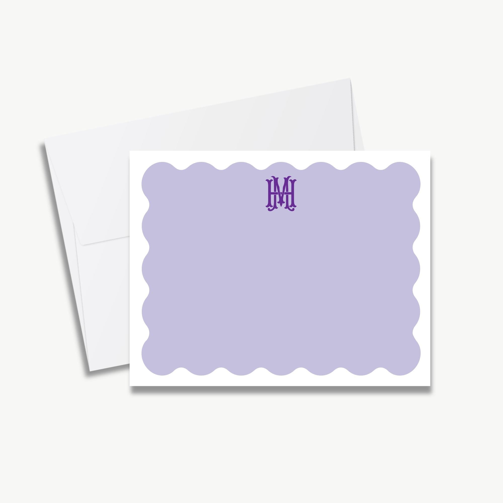 a white envelope with a purple scalloped border and a purple monogram logo on the top right corner.