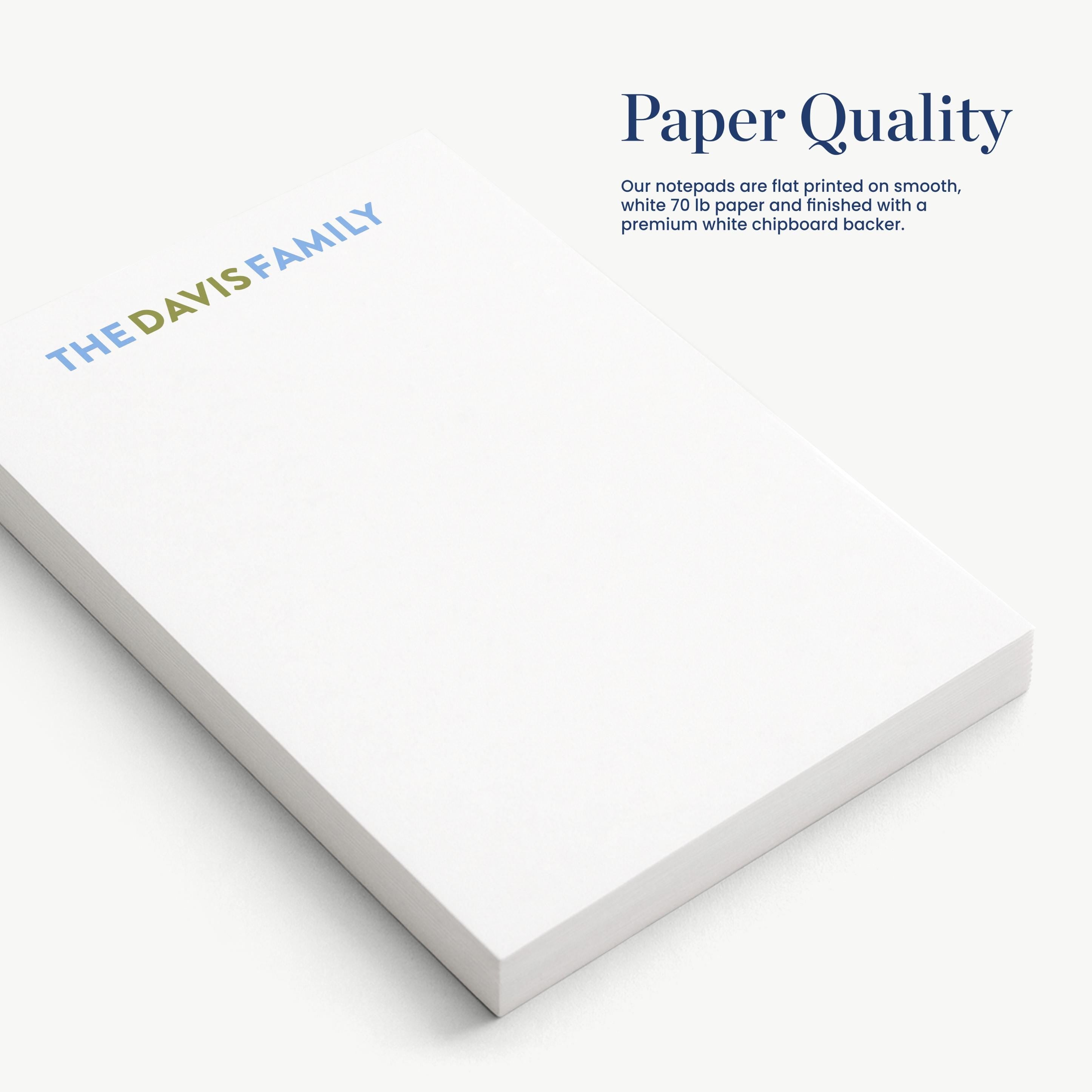 a close-up view of a white notepad with the text "Paper Quality" printed on it.