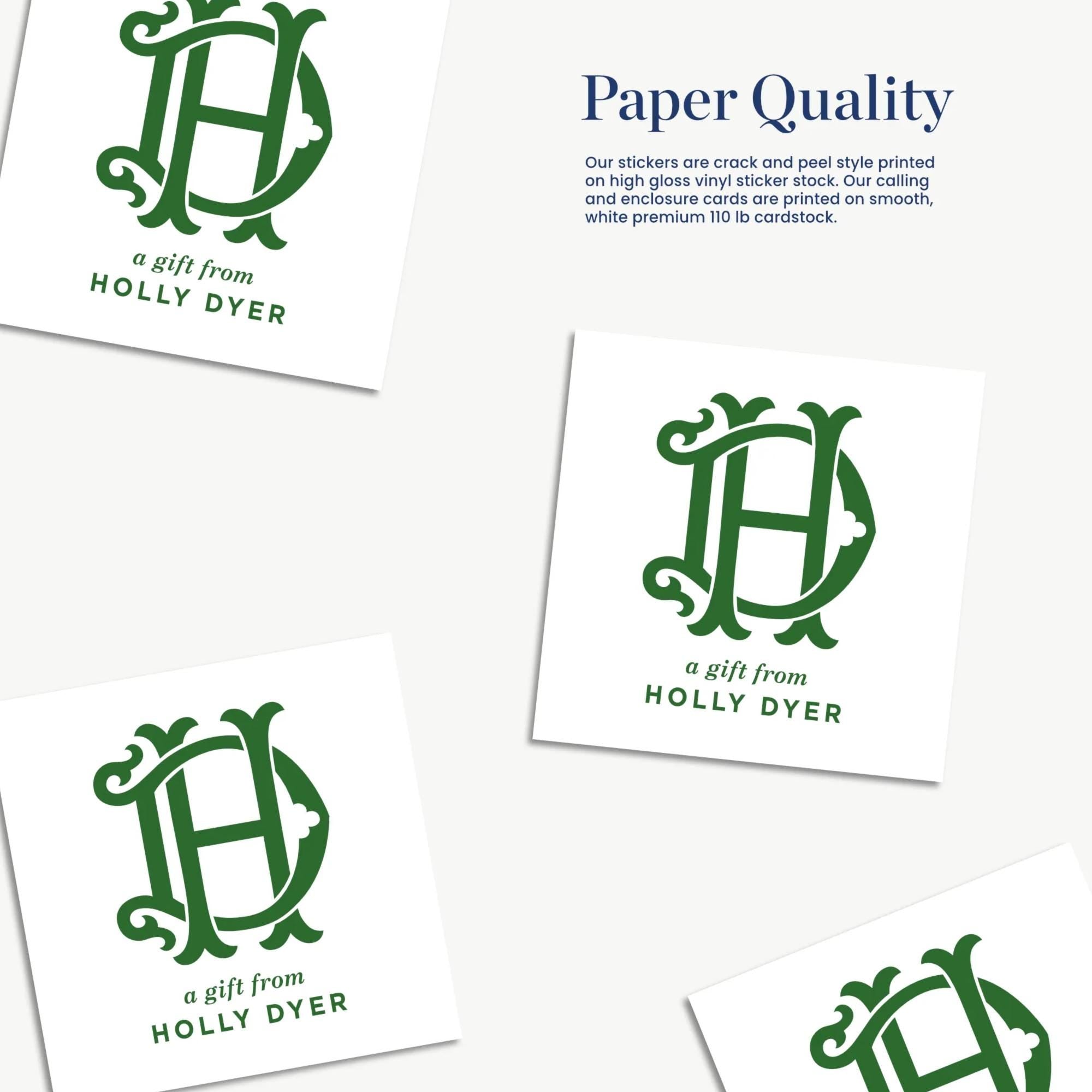 a collection of green stickers with a monogram design, featuring the letters "HD" in a decorative font. The stickers are described as "Paper Quality" and "a gift from Holly Dyer", suggesting that they are a product or promotional item related to the brand or company.