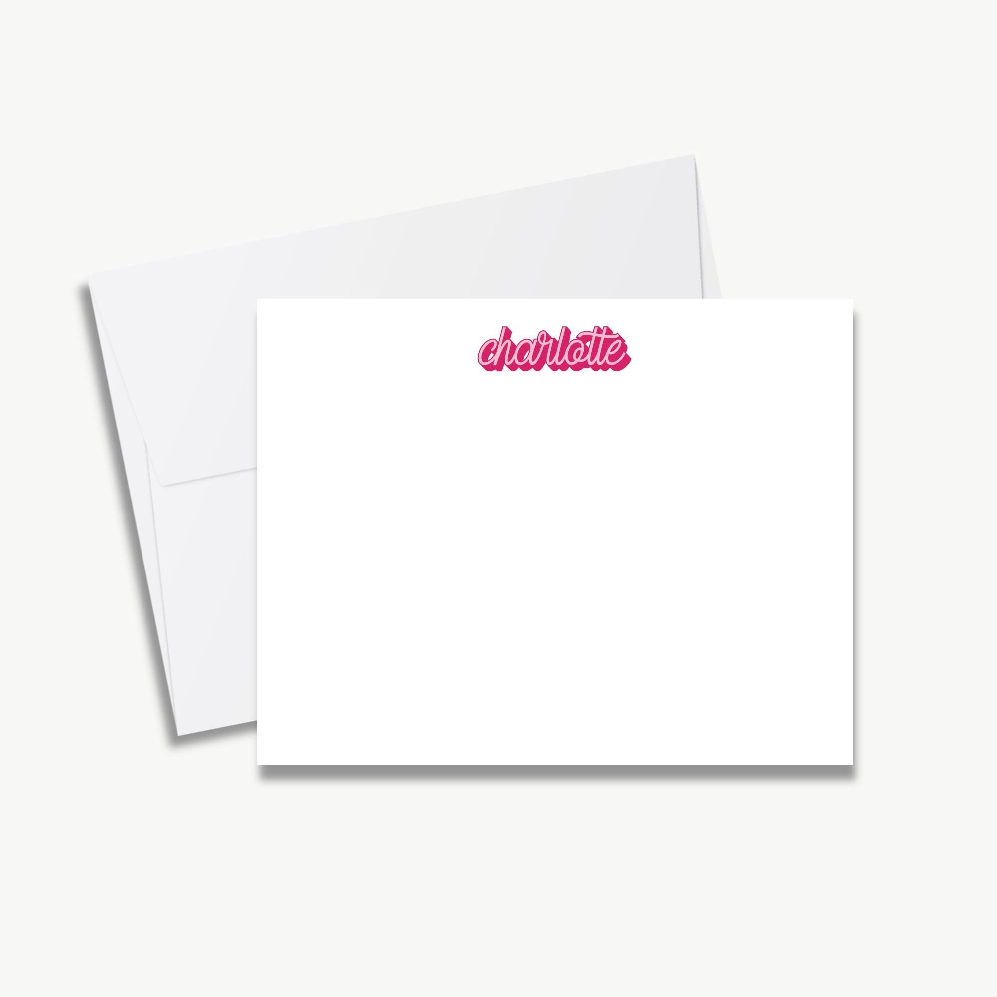 A blank white card with the name "Charlotte" printed in pink cursive text on it.