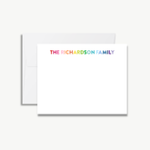 A white envelope with a blank card inside, featuring the text "THE RICHARDSON FAMILY" in a rainbow color scheme.