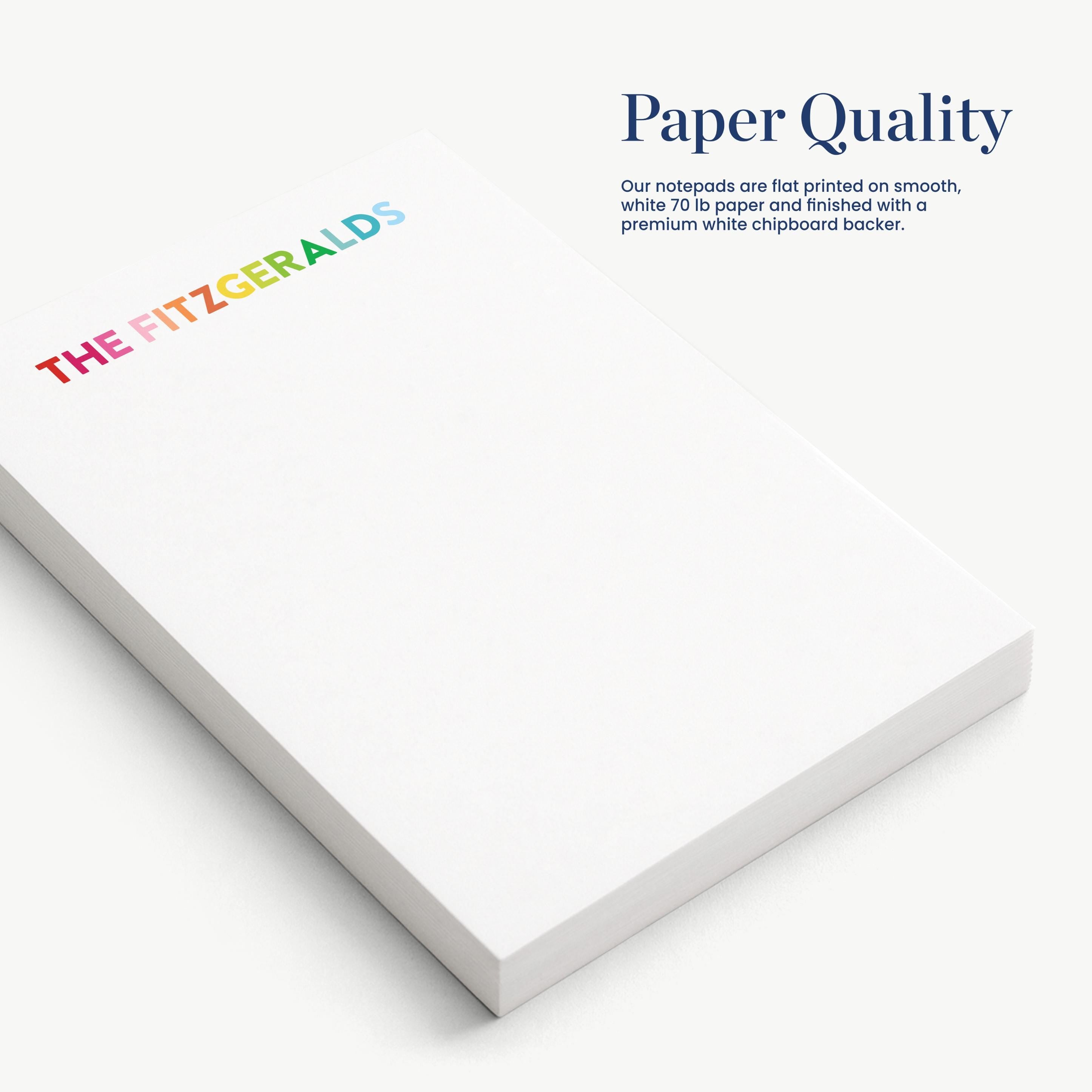 a close-up view of a white notepad with the text "Paper Quality" printed on it.