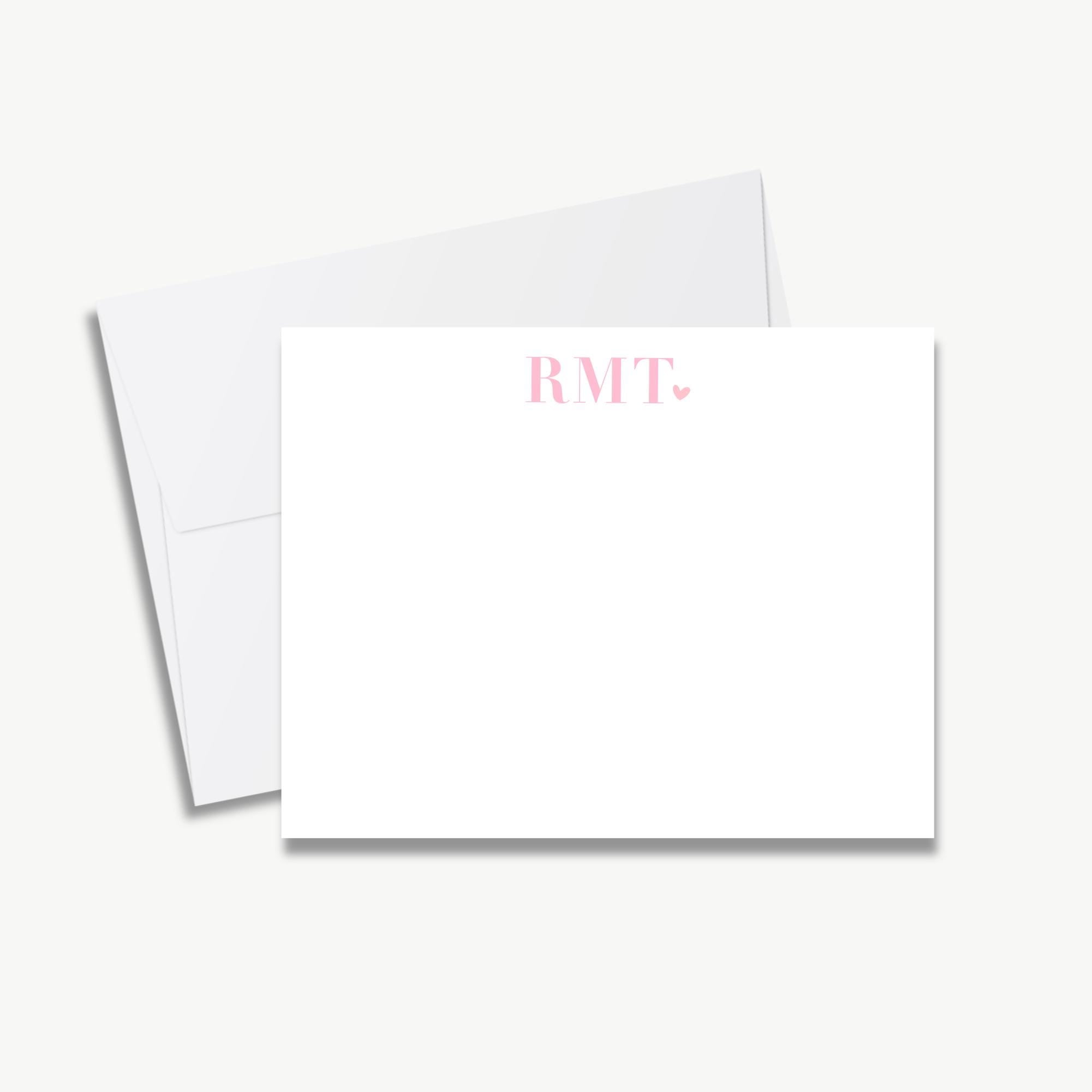 a blank white card with the text "RMIT" printed on it, placed on top of an envelope.