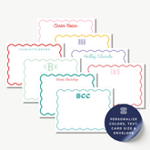 a collection of personalized name cards with scalloped edges, each featuring a different name and color. The cards are arranged in a row, showcasing a variety of names and colors.