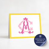 a yellow and white card with a pink monogram design on it.