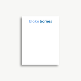 A white piece of paper with the name 'blake Barnes' written on it in blue text.