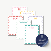 a collection of personalized stationery items, including name cards and monogrammed designs.