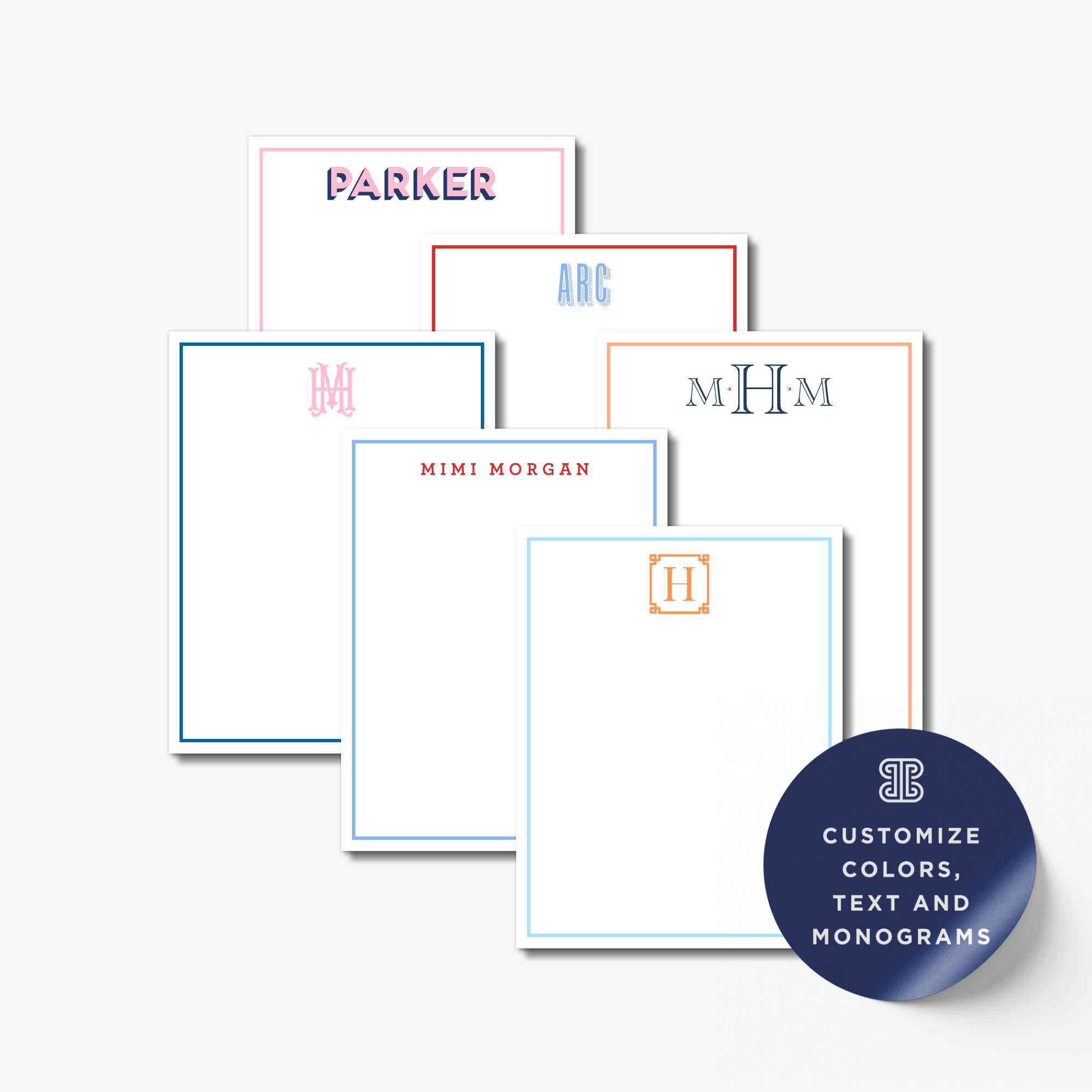 a collection of personalized stationery items, including name cards and blank pads, each with a unique monogram or name.