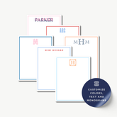a collection of personalized stationery items, including name cards and blank pads, each with a unique monogram or name.