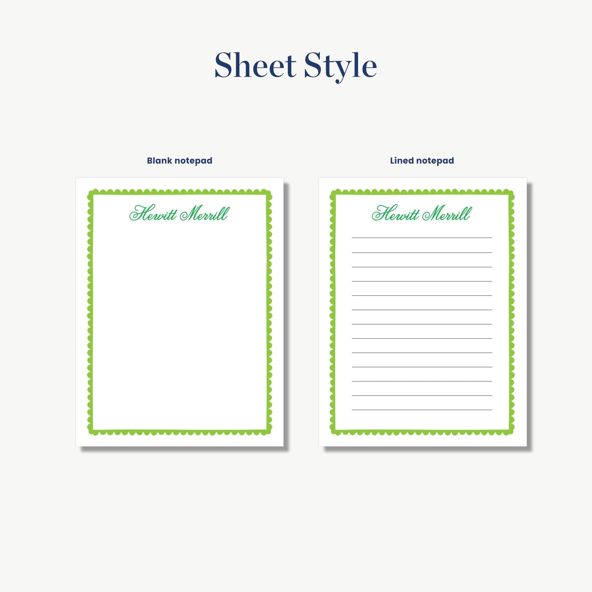 two blank notepads with a green border, one blank pad and one lined pad, both with the name "Hewitt Merrill" printed on them.