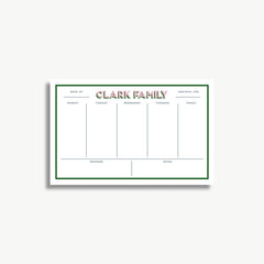 A white and green weekly schedule planner with the name "CLARK FAMILY" printed on it.