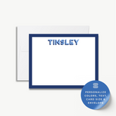 a blank blue-bordered card with the name "Tinsley" written on it.