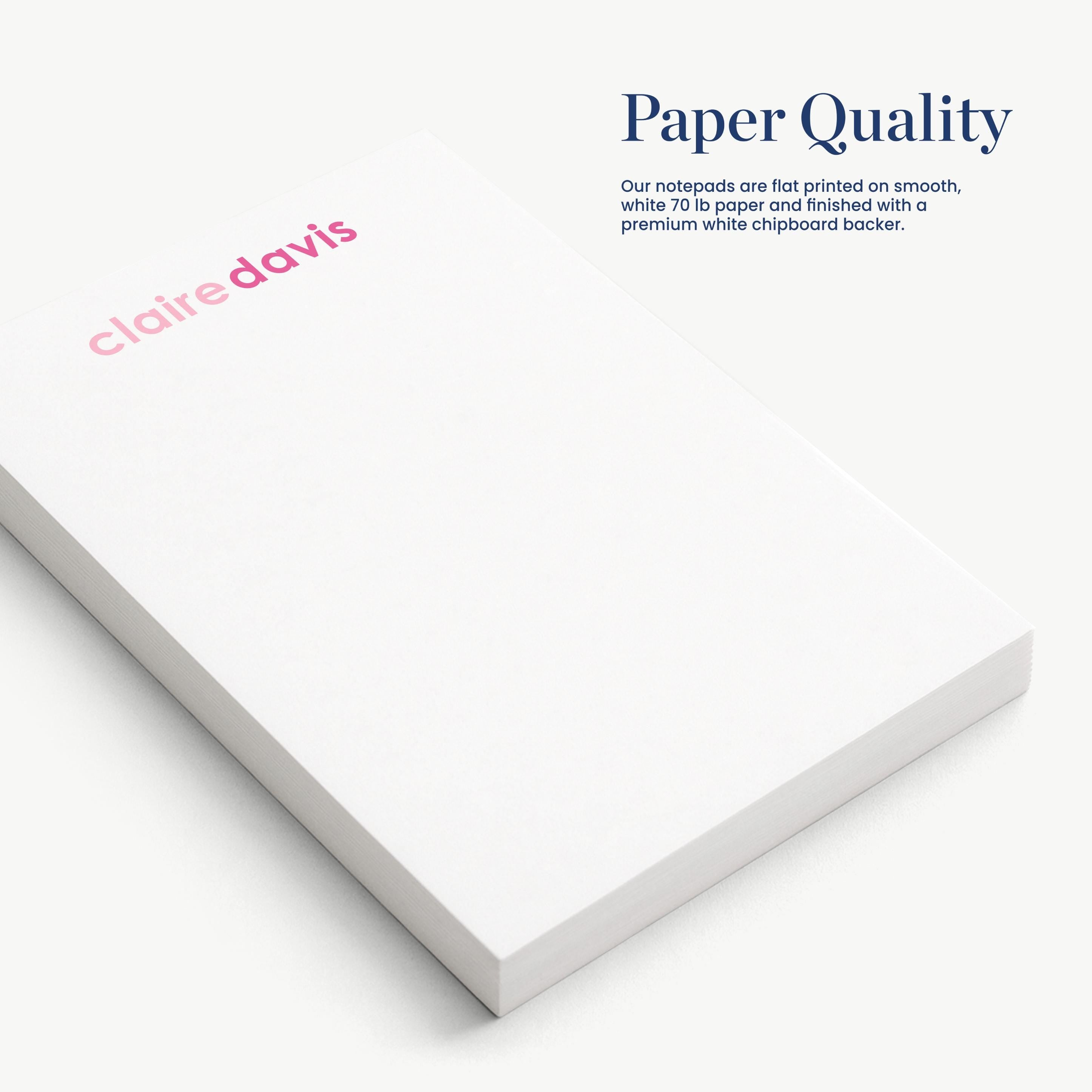 a close-up view of a white notepad with the name 'claire davis' printed on it.