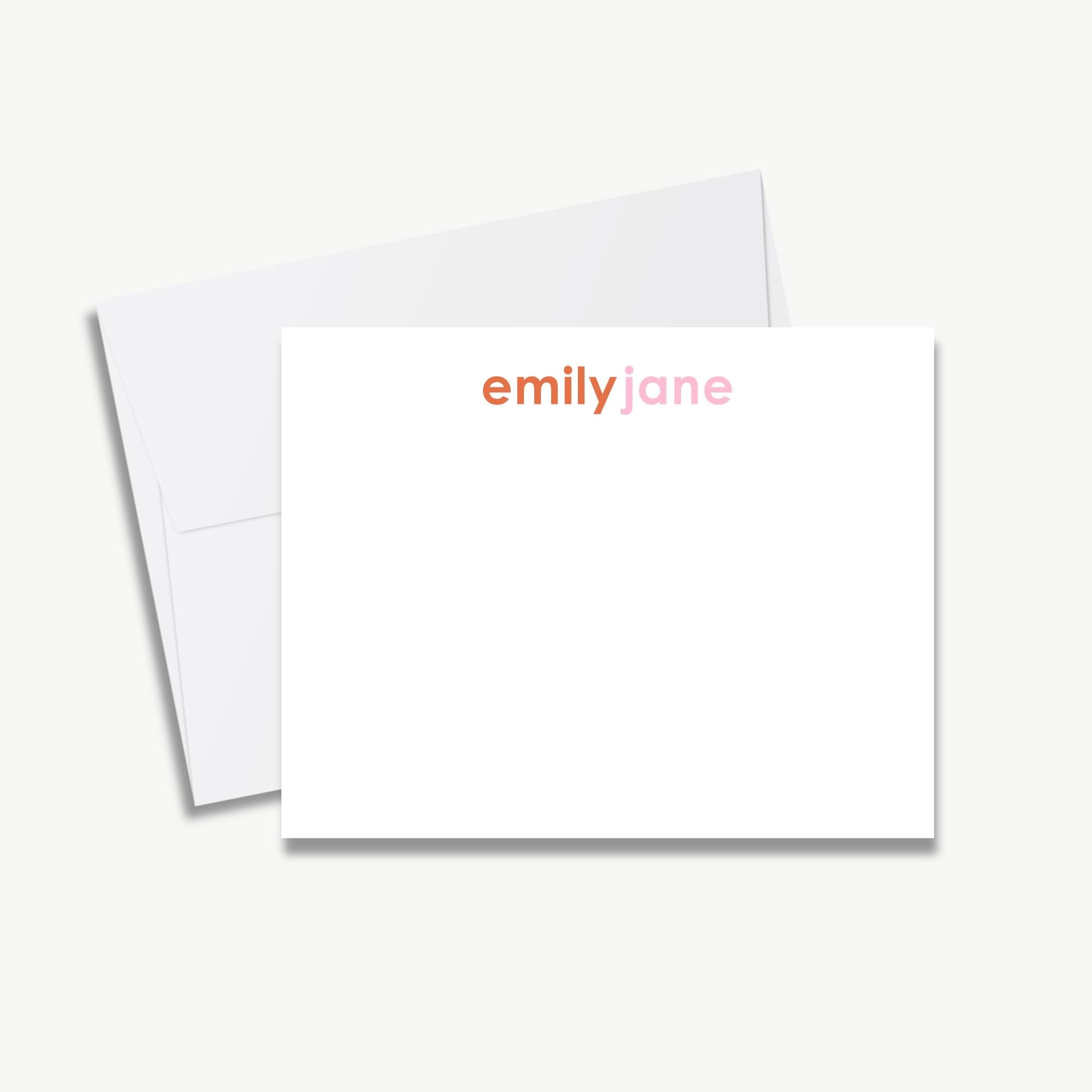 A blank white card with the name 'emily jane' printed on it, placed on top of an envelope.