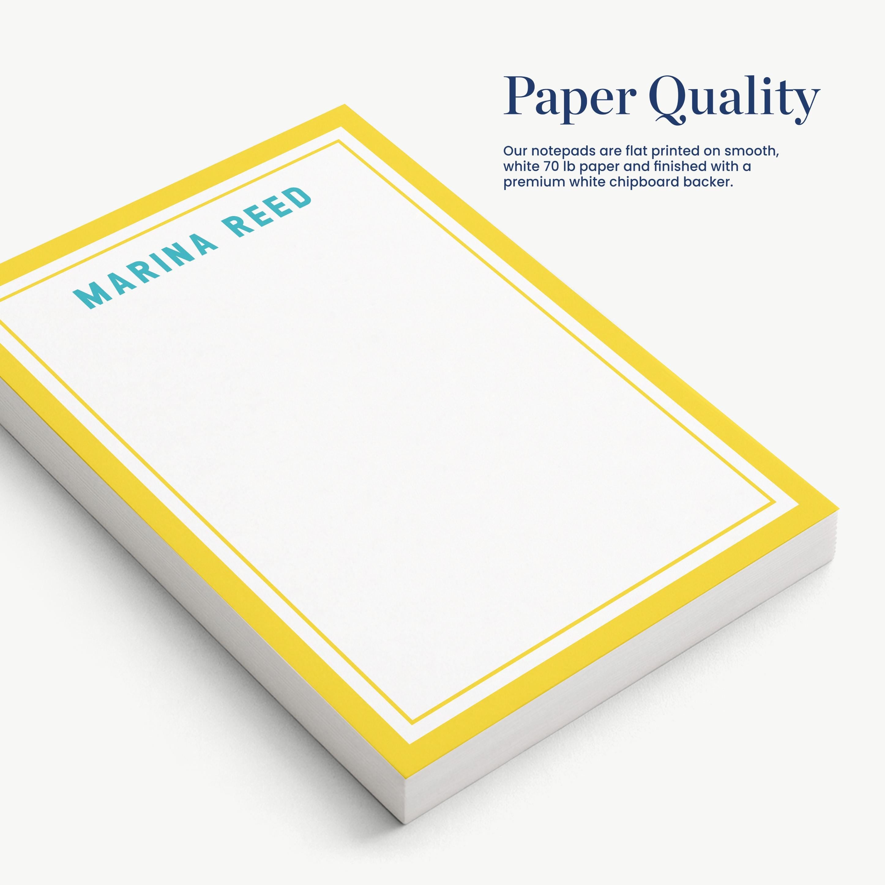 a stack of white notepads with a yellow border, labeled "Marina Reed" in teal text.
