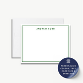 a white card with a green border, and there is a blue envelope with a sticker on it.
