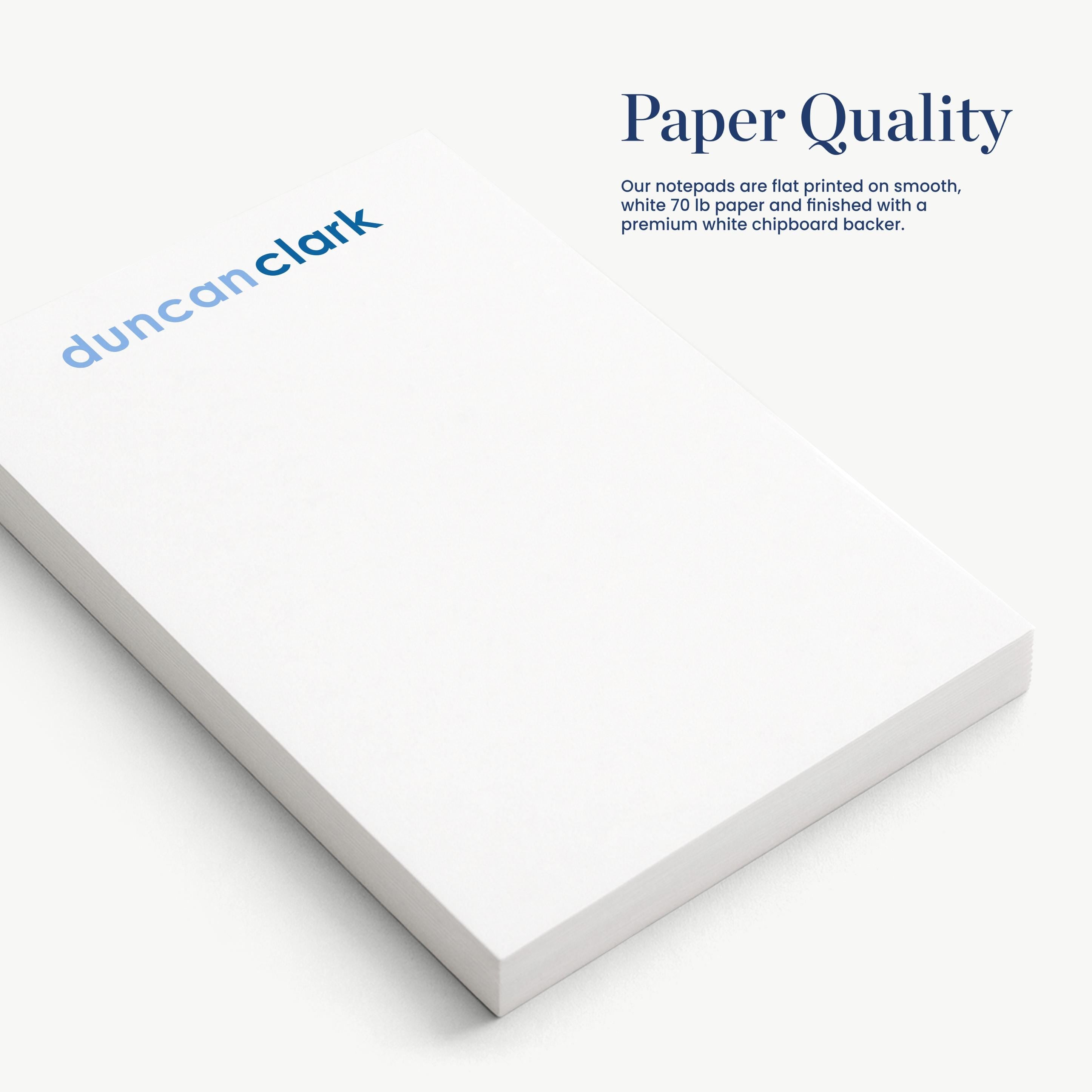 a close-up view of a white notepad with the text "Paper Quality" and "Duncan Clark" printed on it.