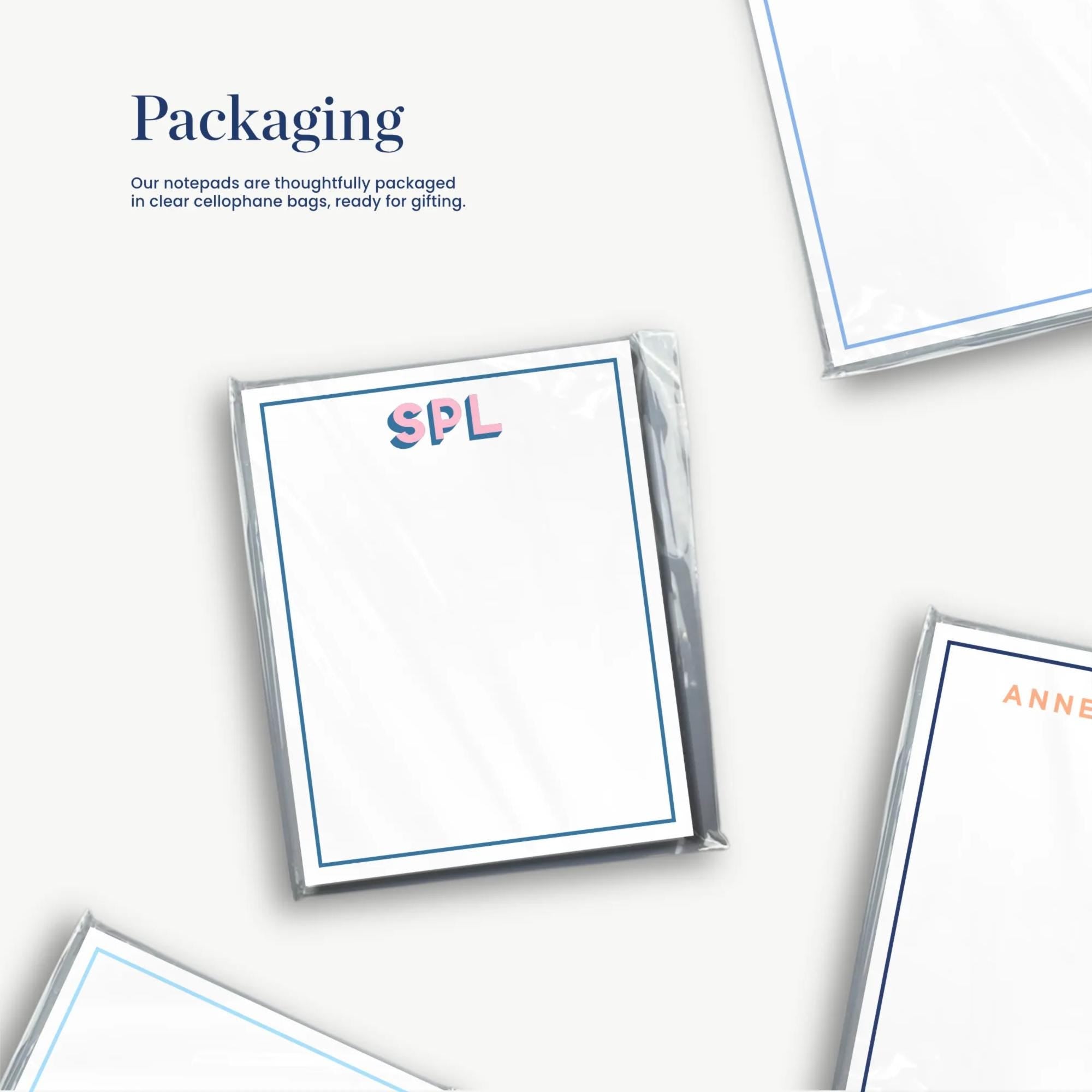 several blank notepads with the text "Packaging" written on them.