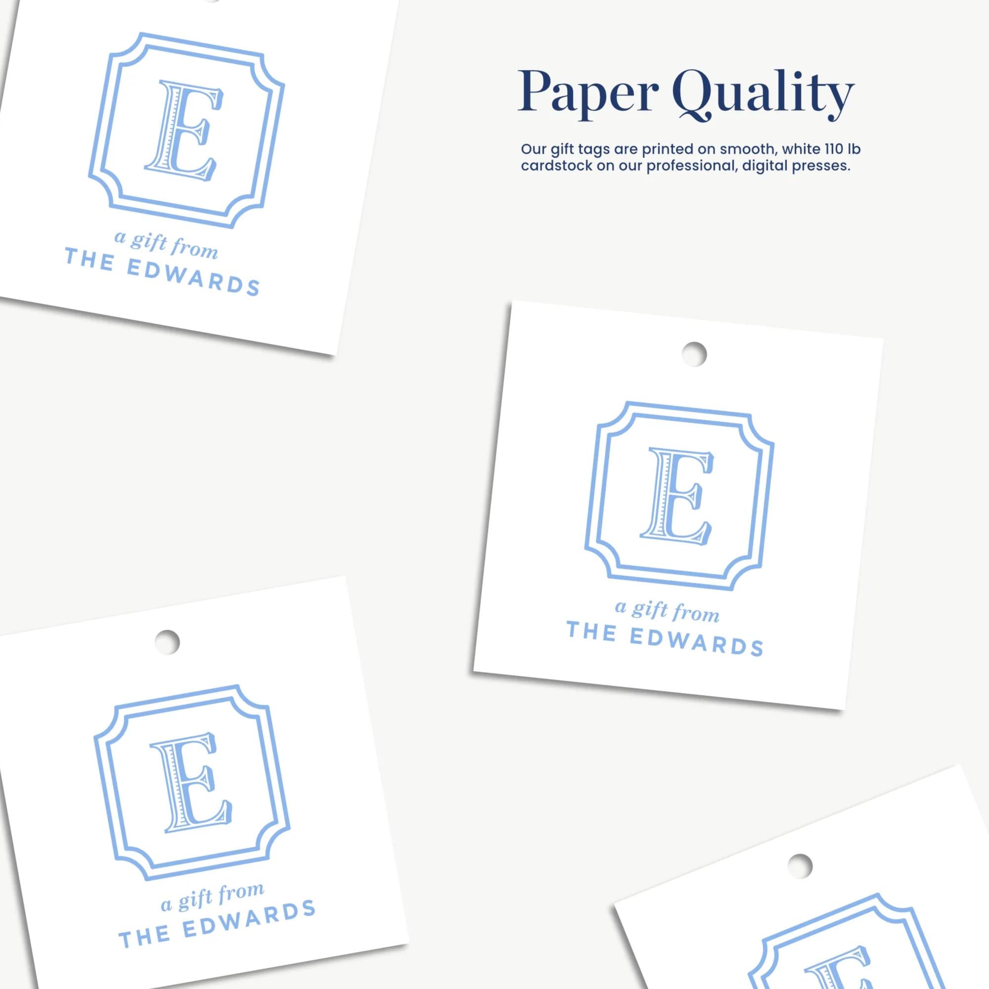 a collection of four paper tags, each featuring a blue and white logo with the letter "E" in the center. The text on the tags indicates that they are "Paper Quality" gift tags, printed on smooth, white, 110 lb cardstock, and designed for professional digital presentations.