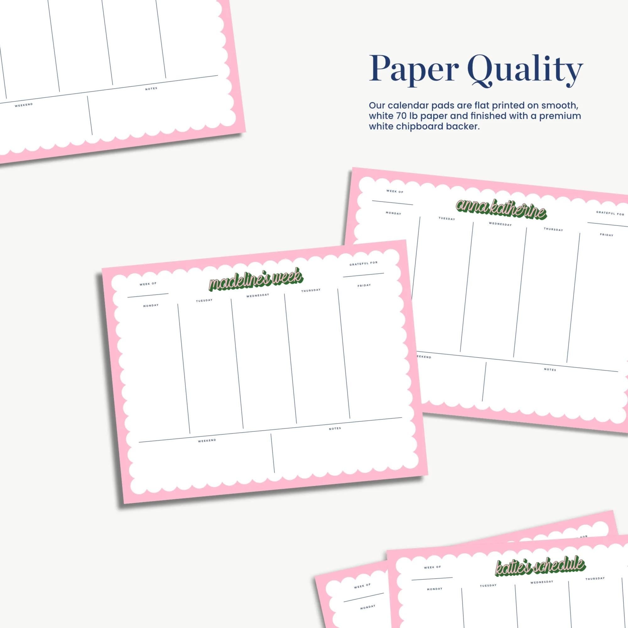 a collection of pink-bordered paper pads with blank pages, likely used for planning or organizing tasks.