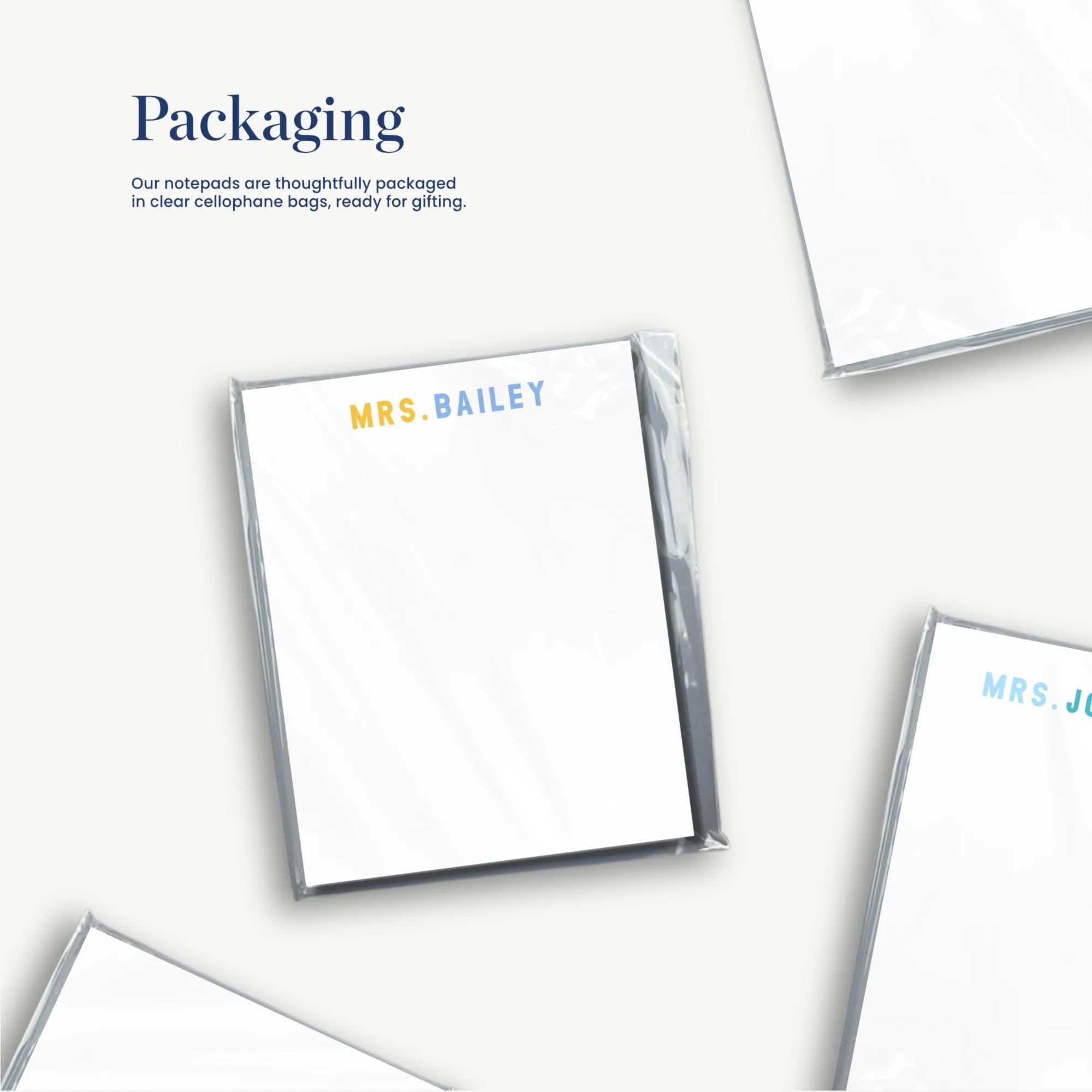 three pieces of paper with the names 'Mrs. Bailey' and 'Mrs. Jones' printed on them, along with the text 'Packaging' and 'our notebooks are securely packaged in clear cellophane bags, ready for gifting'.
