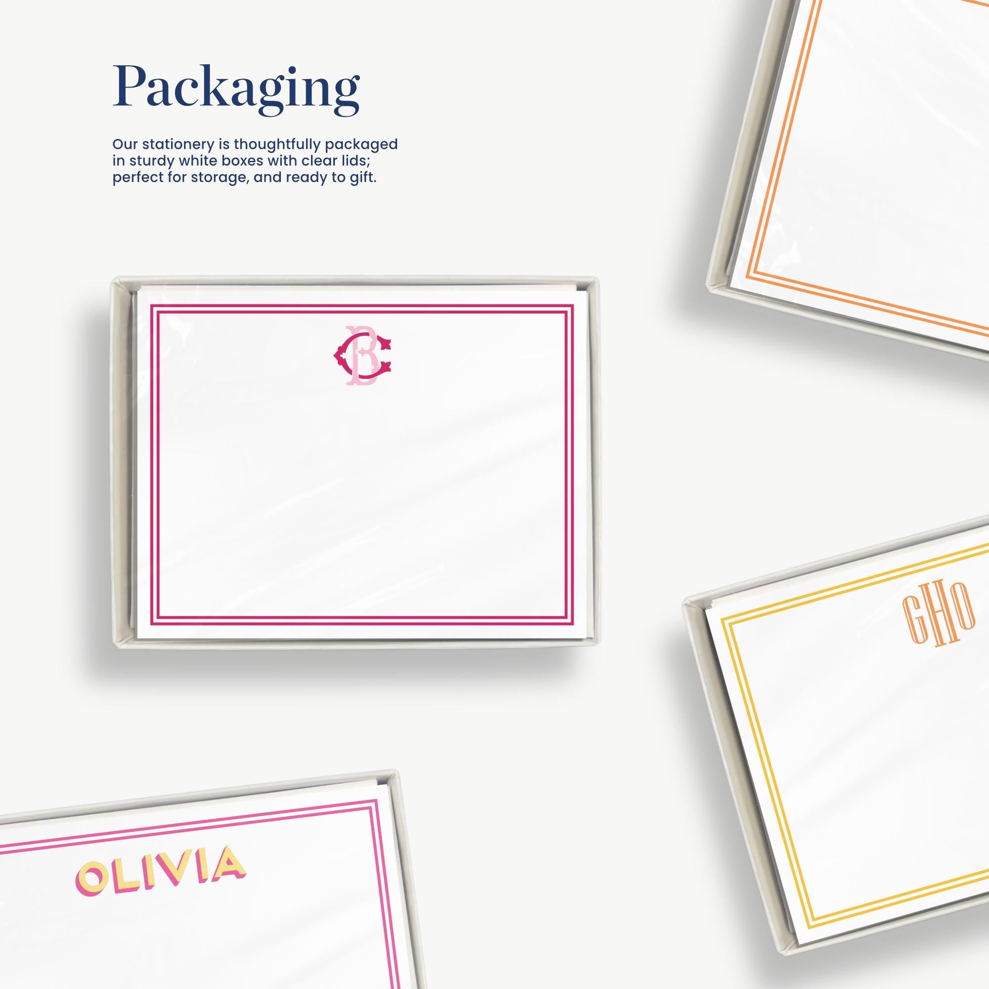a set of stationery items, including personalized note cards and envelopes, with a focus on their packaging.
