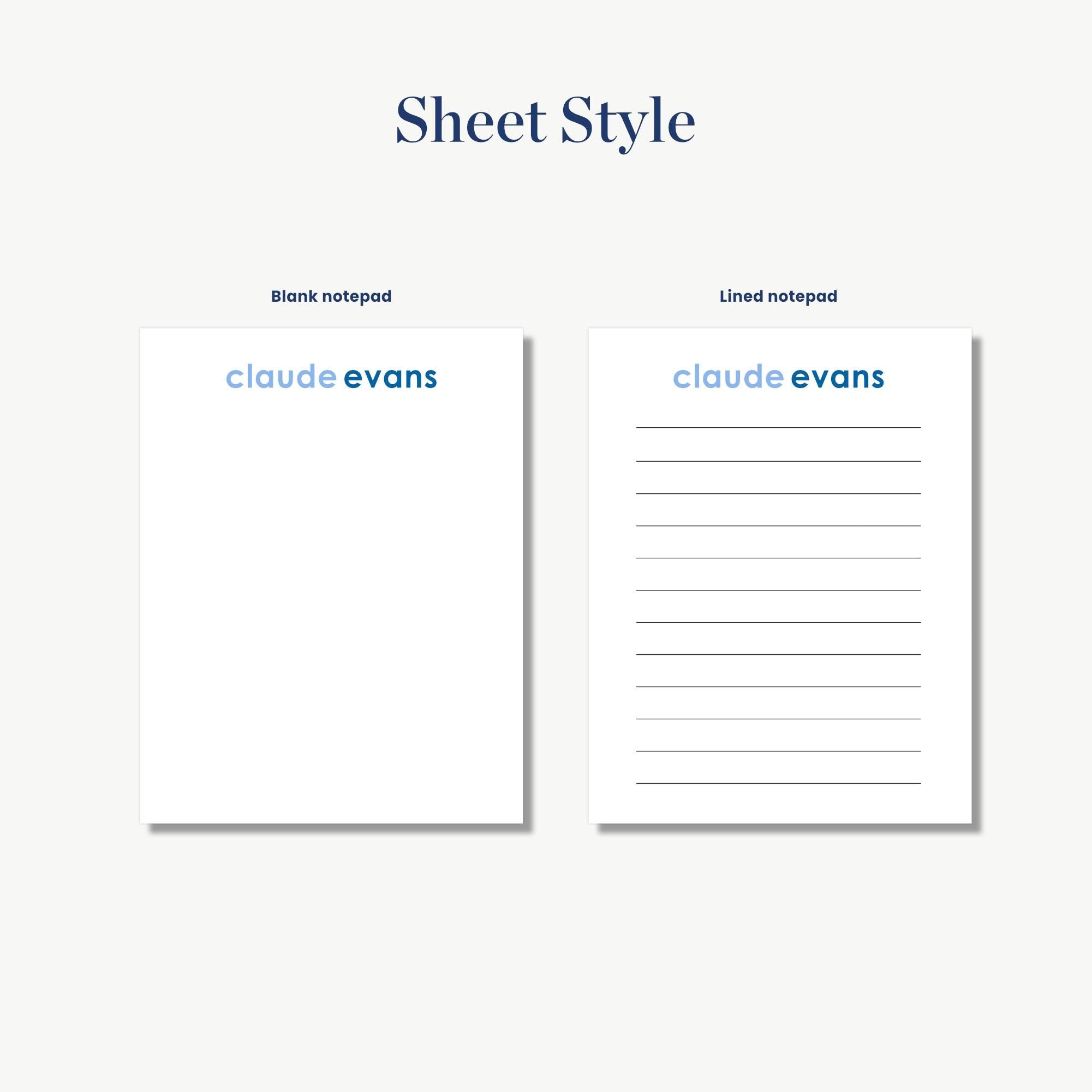two blank notepads with the name 'Claude Evans' written on them.