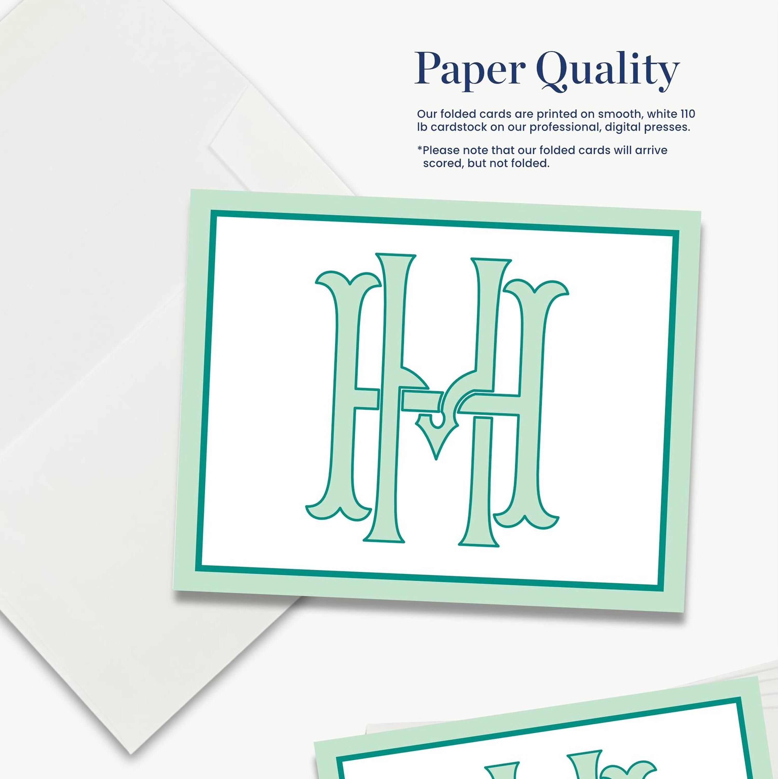 The image is a close-up of a printed card with a large monogram design, and it is described as a "Paper Quality" card.
