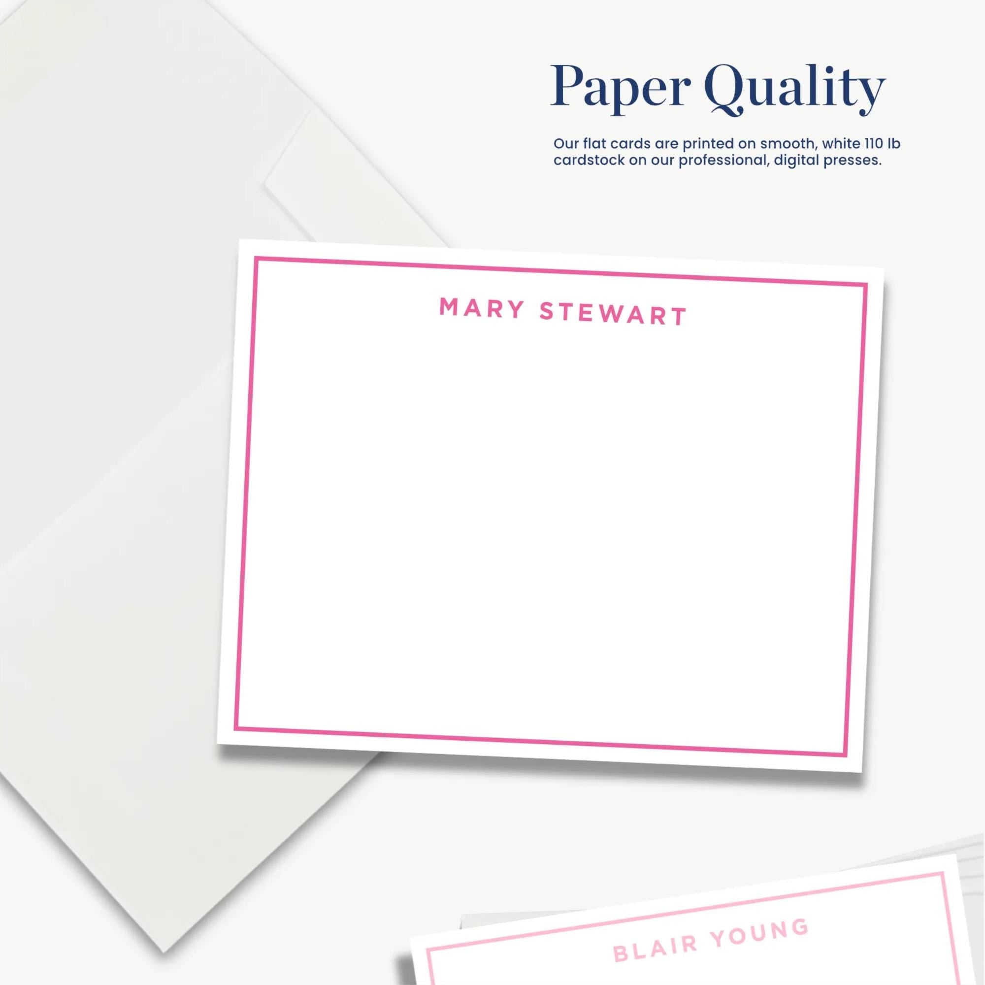 The image is a white card with a pink border, featuring the names "Mary Stewart" and "Blair Young" printed on it. The card is placed on a white background, and there is a white envelope in the background as well.
