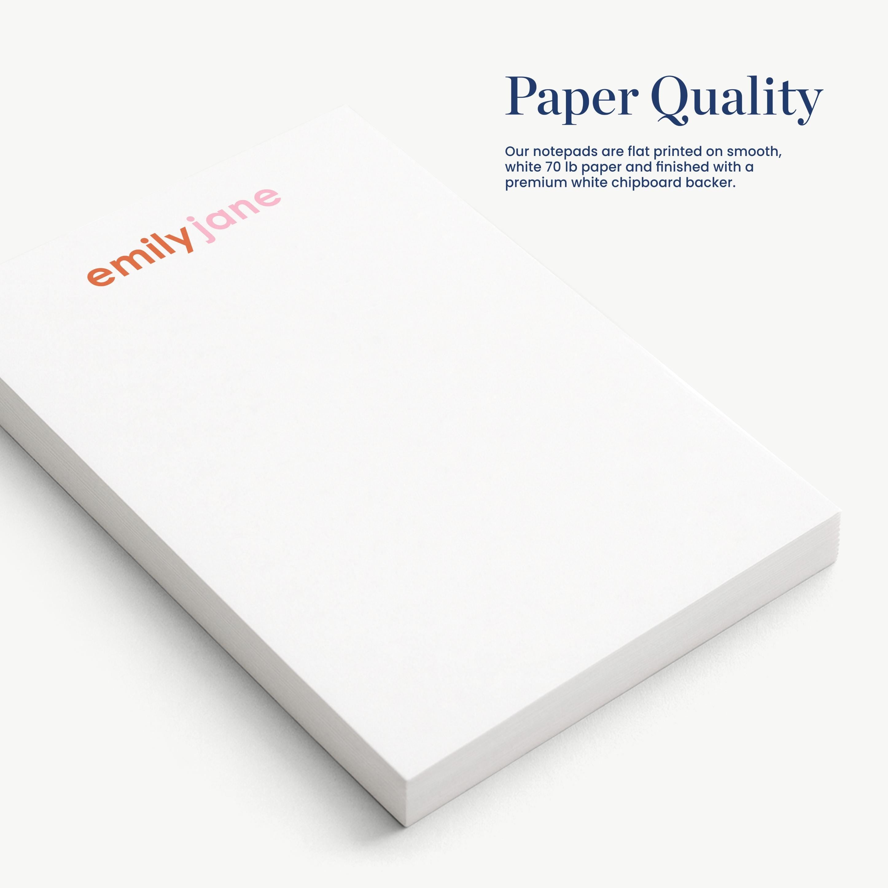 a close-up view of a white notepad with the name 'emilyjane' printed on it.