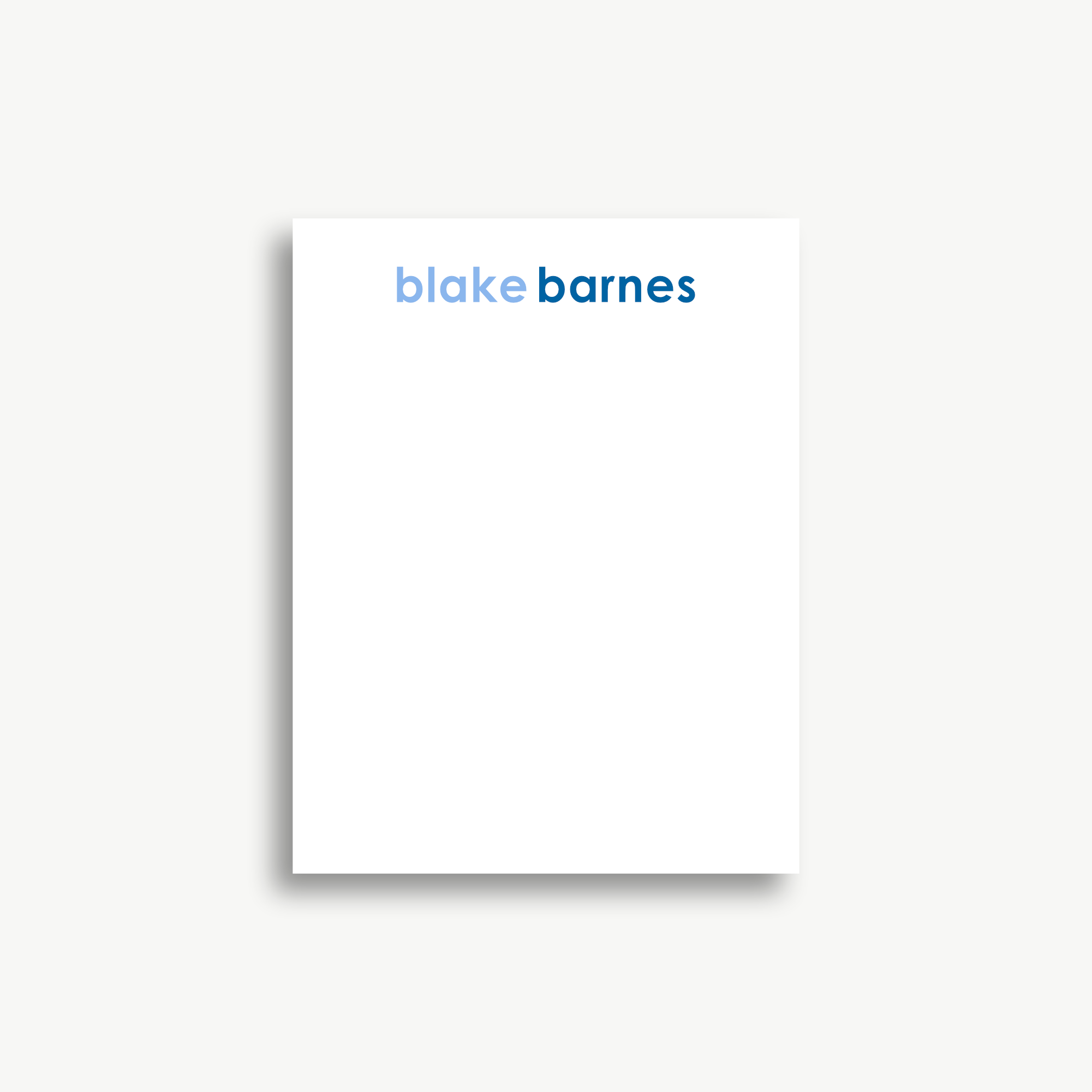 A white piece of paper with the name 'blake Barnes' written on it in blue text.