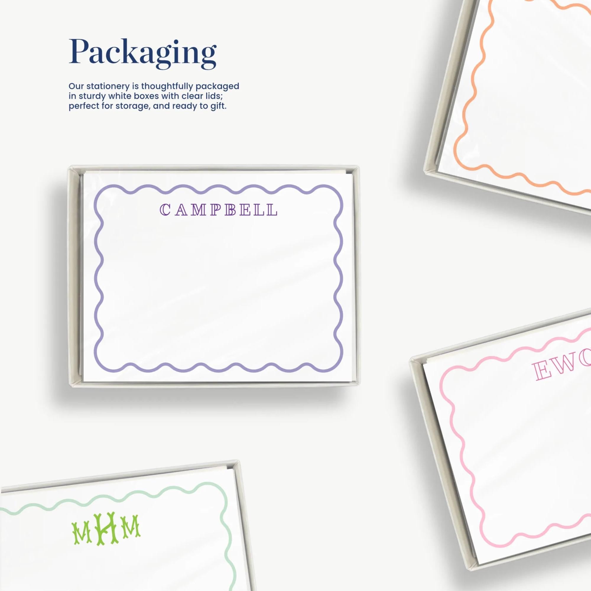 various images of packages and stationery items, including a package with the name 'CAMPBELL' and a note with the name 'E.W.C.' The packaging appears to be thoughtfully designed and ready to give.