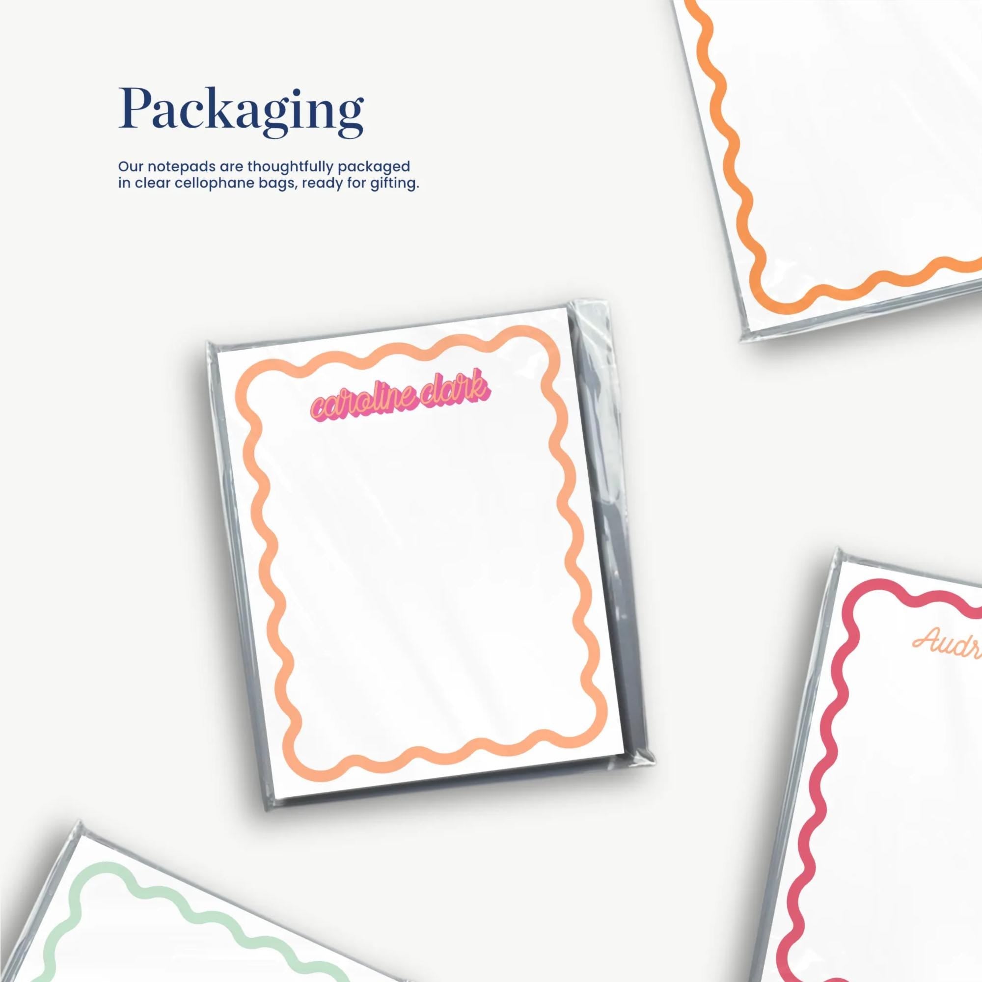 a collection of various shapes and designs, including a note pad, a card, and a piece of paper, all with a wavy border.
