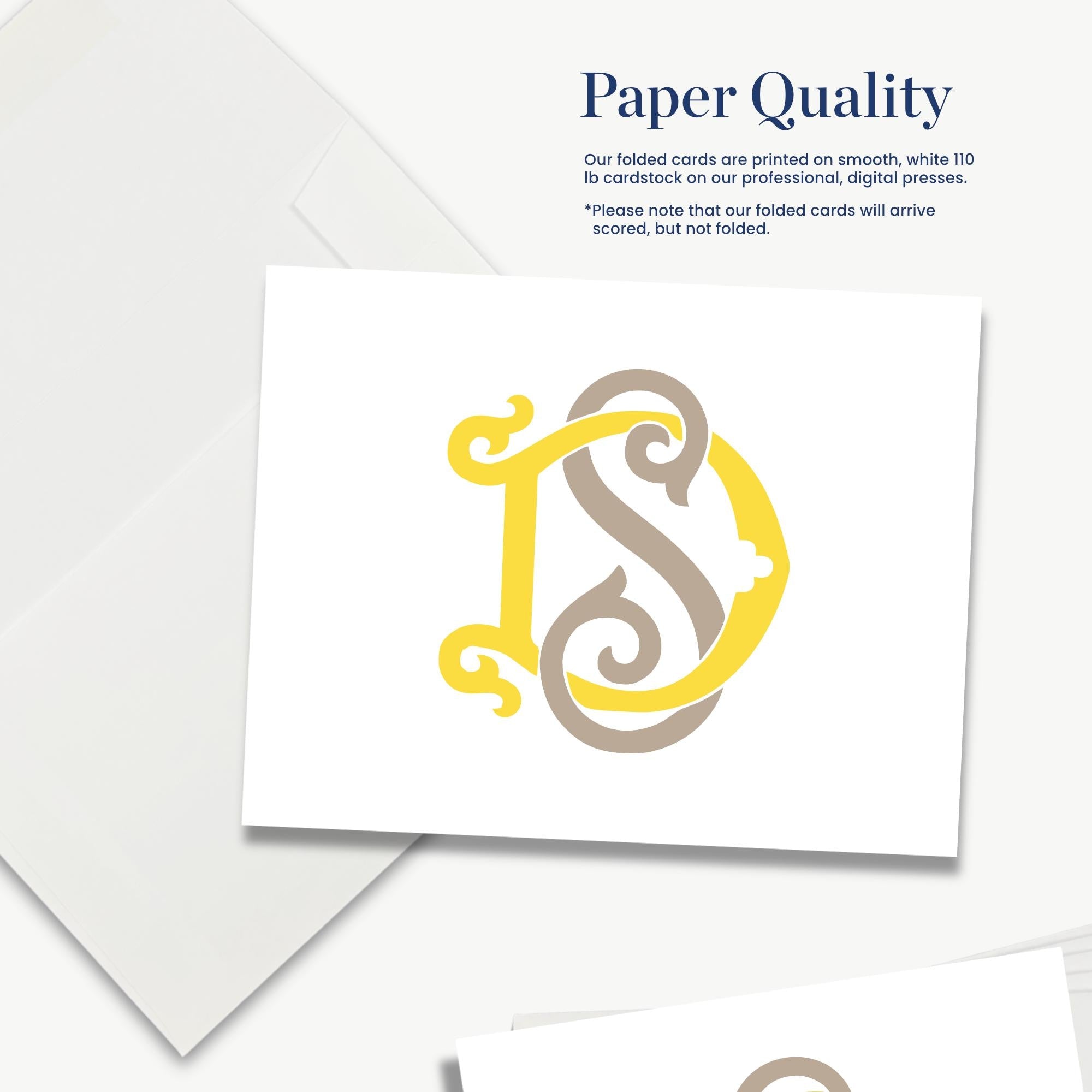 a white cardstock with a folded letter "D" and some text, likely providing information about the quality of the paper used for printed cards.