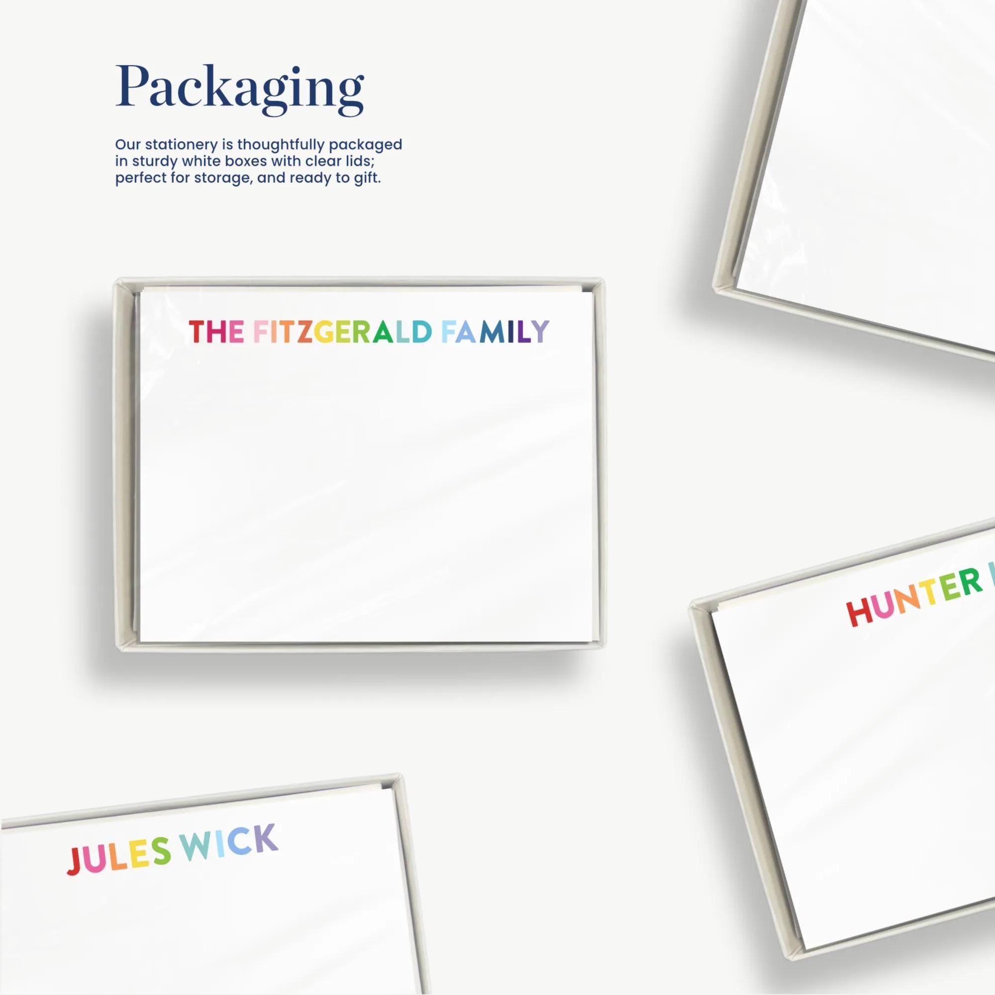 The image is a collage of four images, each featuring a different colored box with the name "The Fitzgerald Family" printed on it. The boxes are white and appear to be made of a material that resembles clear plastic or transparent material. The text "Packaging" is visible in the image, suggesting that the boxes are being used for storage or gift purposes.
