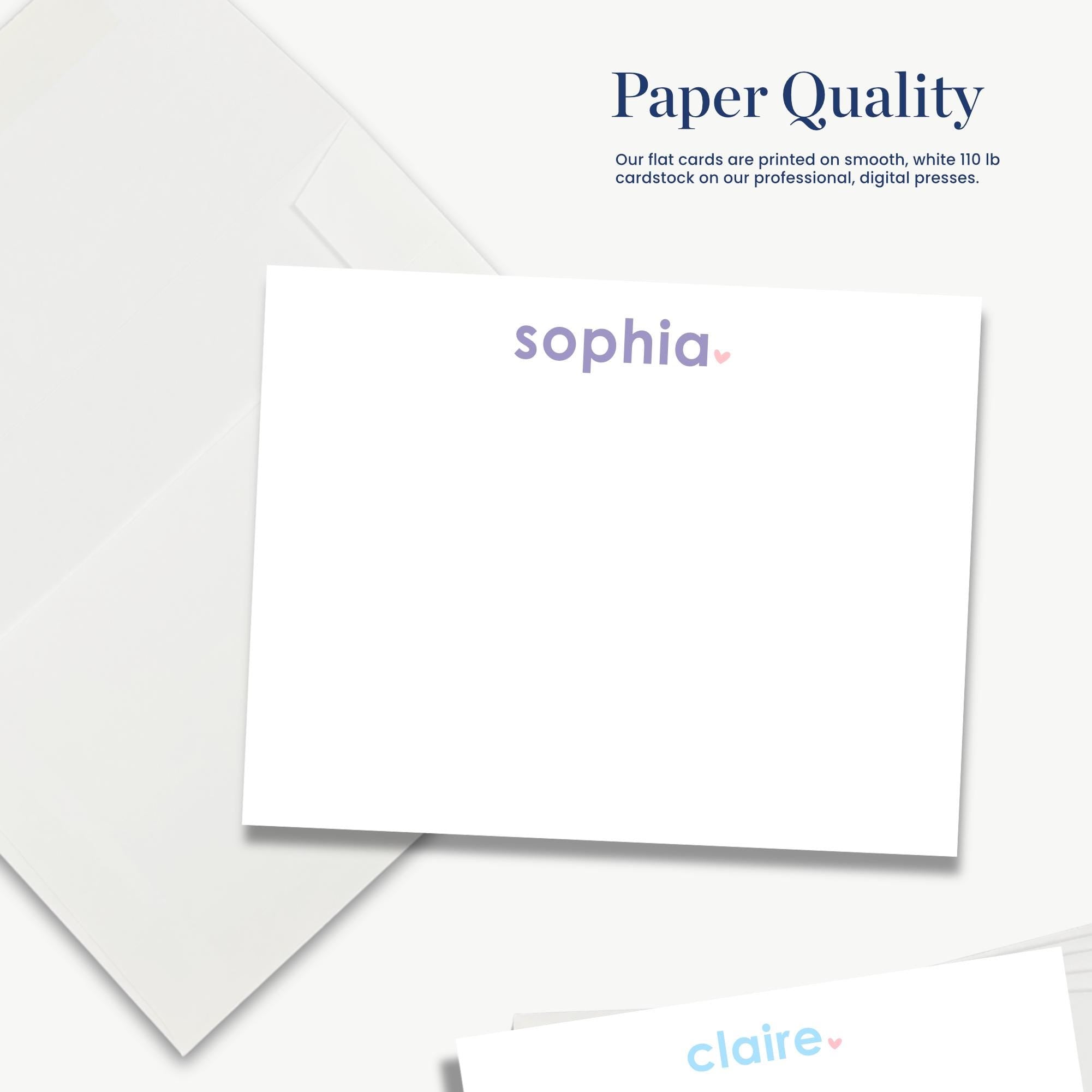 The image is a white card with the word "sophia" printed on it, along with a logo. The card is placed on a white background, and there is a small piece of paper with the word "claire" printed on it.