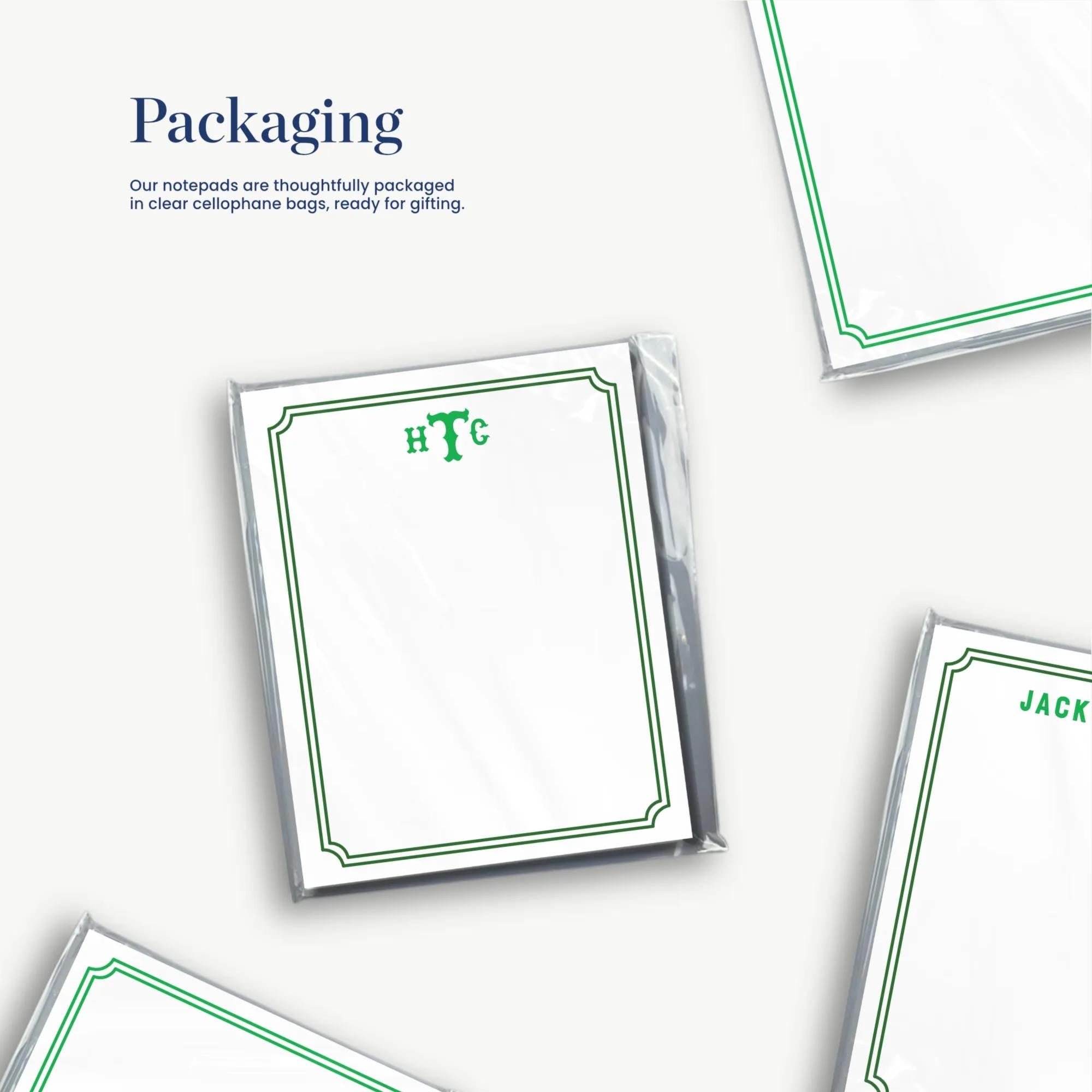 several blank note pads with green borders, along with some text and logos. The note pads appear to be used for writing or note-taking purposes.