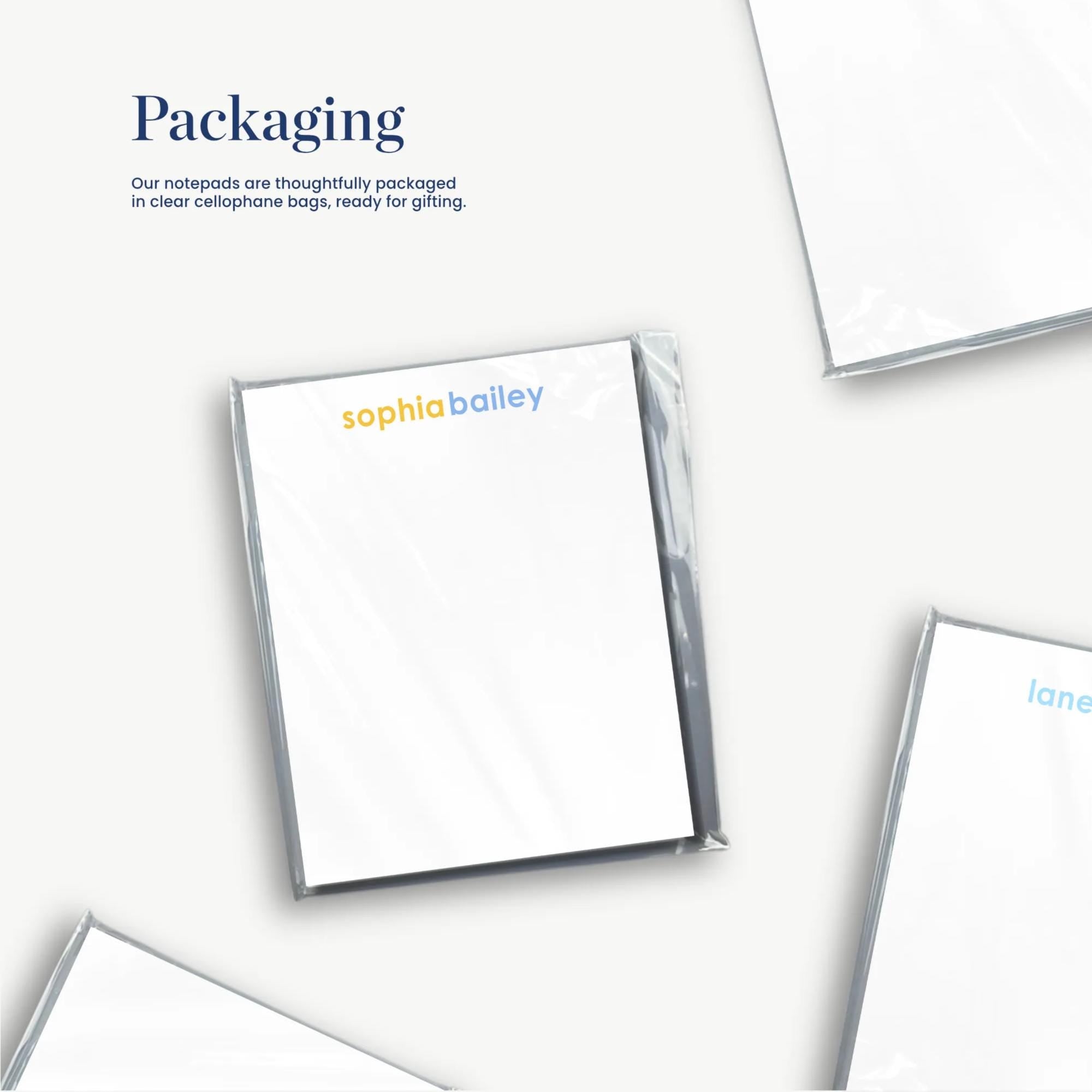 several white pieces of paper or cards with text on them, arranged in a collage-like manner.