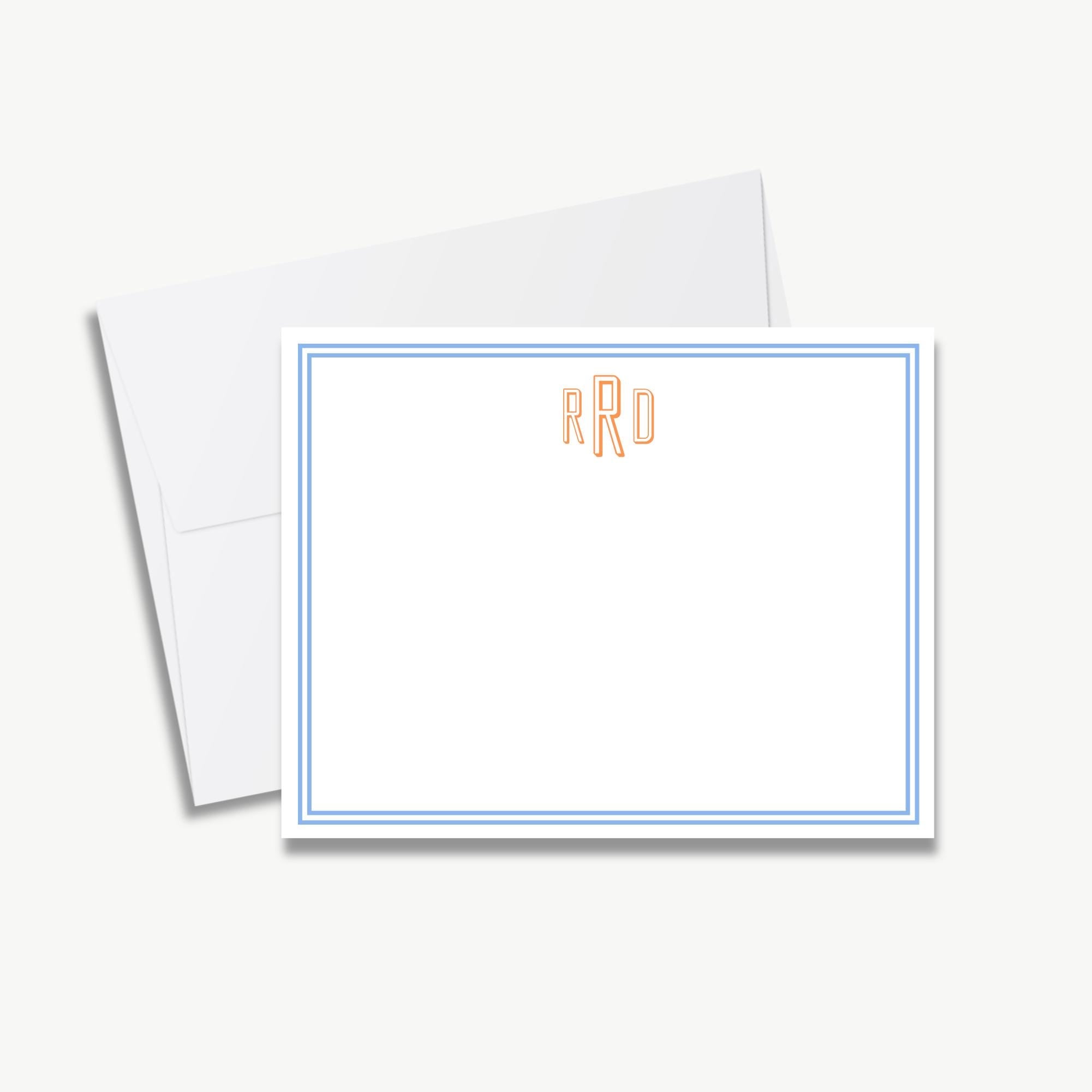 a white envelope with a blue border, and a blank white card with a blue border.