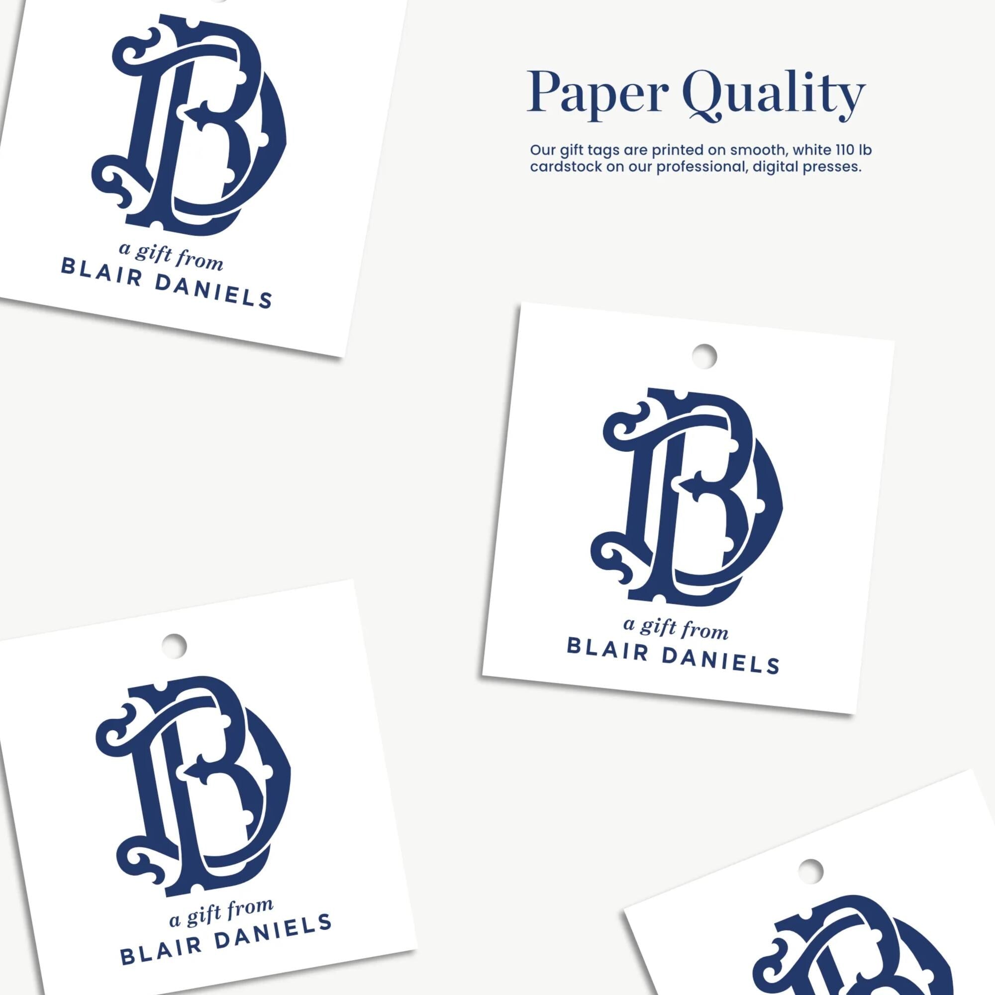a collection of four paper tags, each featuring a logo and text. The tags are printed on smooth, white paper and are designed to be used as gift tags. The text on the tags reads "a gift from BLAIR DANIELS" and "a gift from BLAIR DANIELS".