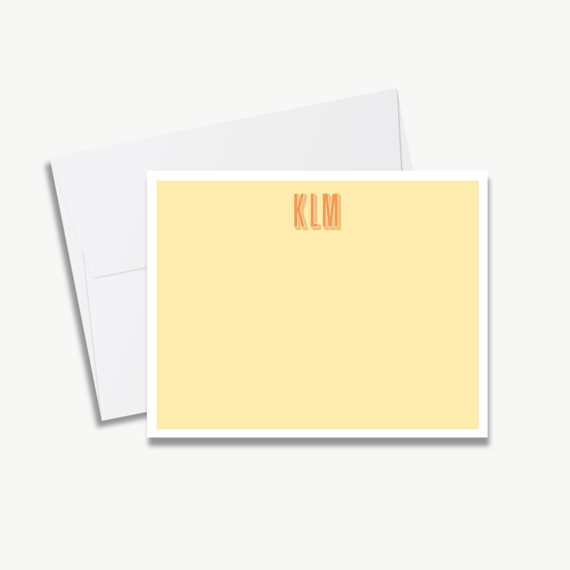A yellow-colored card with a white border, featuring the initials "KLM" printed on it.