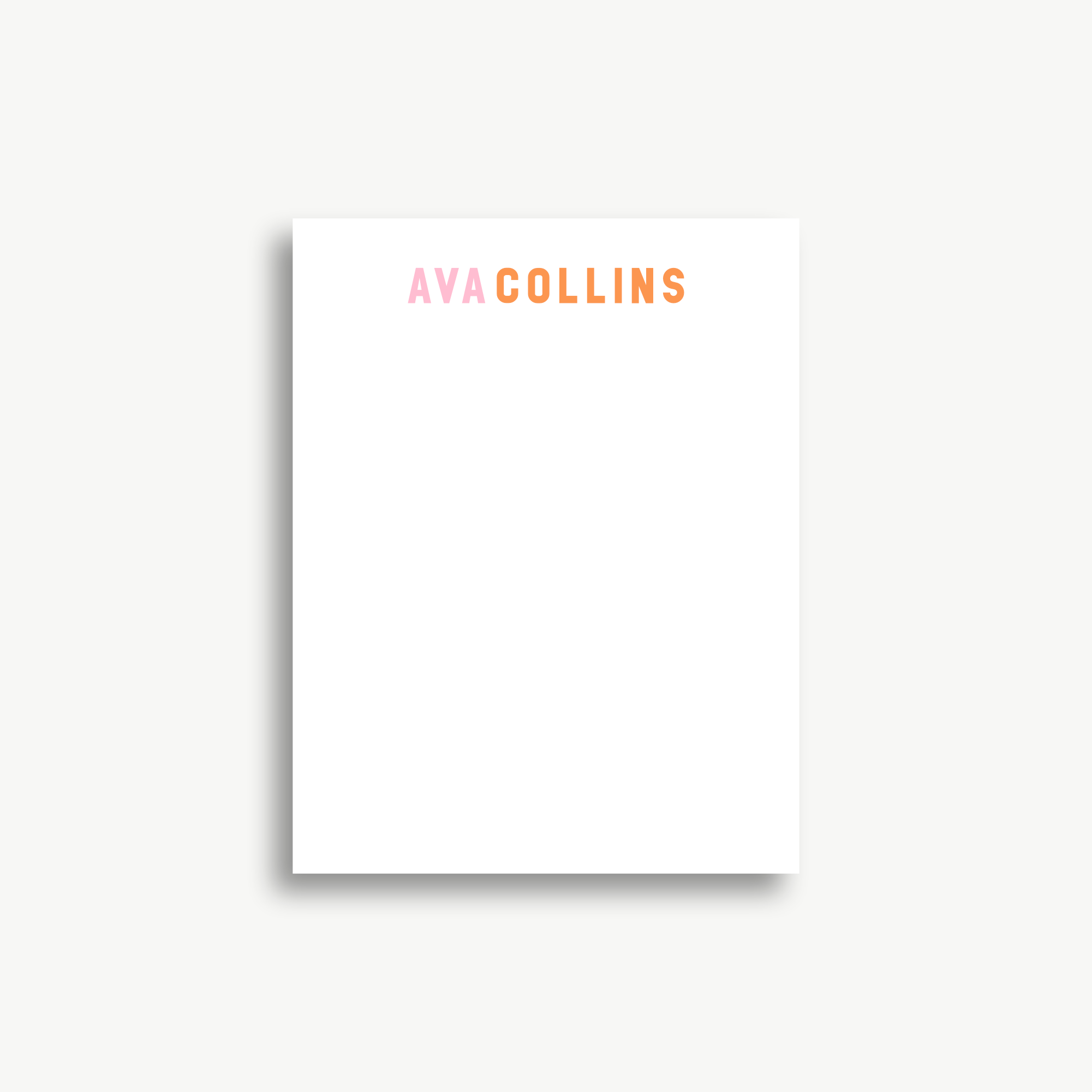 A white piece of paper with the text "AVA COLLINS" printed on it.